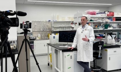 Dr. Aaron Goodarzi speaking to media in the Transdisciplinary Cancer Research Hub (Photo Credit: Joshua Rice, Arnie Charbonneau Cancer Institute)